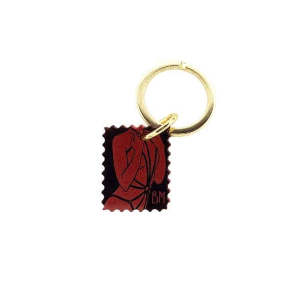 Red, black and gold DOMESTIQUE key ring at BRIGADE MONDAINE