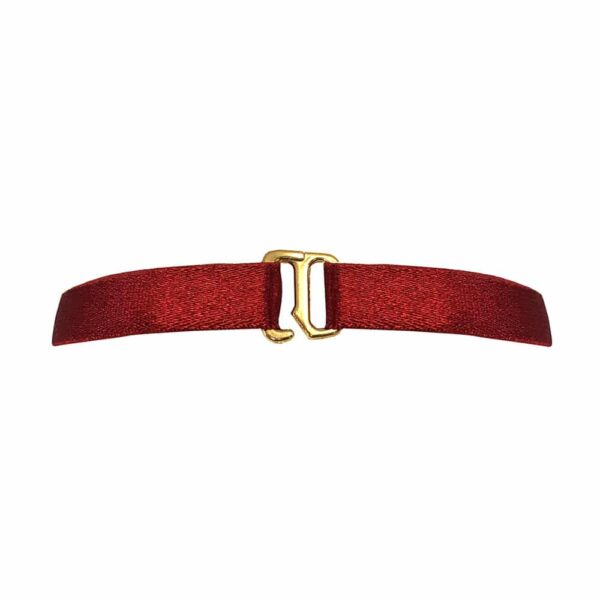 Necklace in red satin elastic with gold metal piece representing an interlacing d'rings in its center, Bordelle Signature at Brigade Mondaine