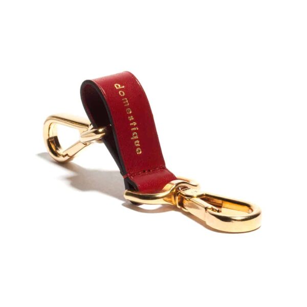 Red leather key ring and golden snap hooks by Domestique Paris at Brigade Mondaine