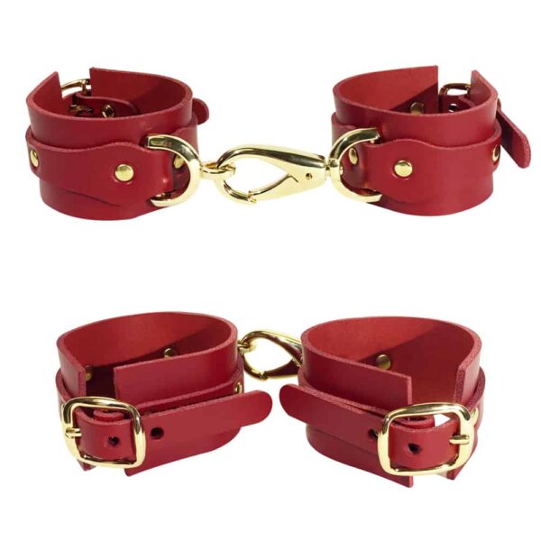Red leather handcuffs with details and gold ELF ZHOU strap at Brigade Mondaine