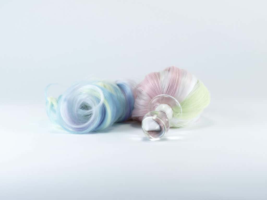 Ponytail-shaped anal plug in rainbow pastel unicorn colors and Borosilicate medical glass