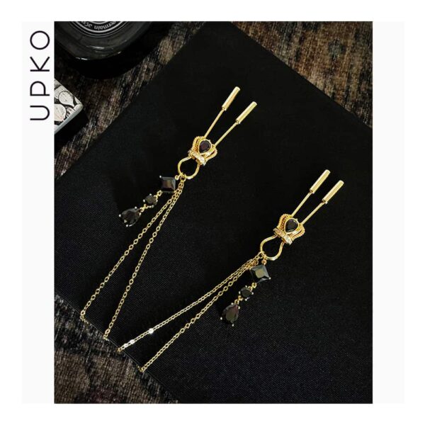 Crown nipple clamps in gold and black crystals with chain and UPKO pendants at Brigade Mondaine