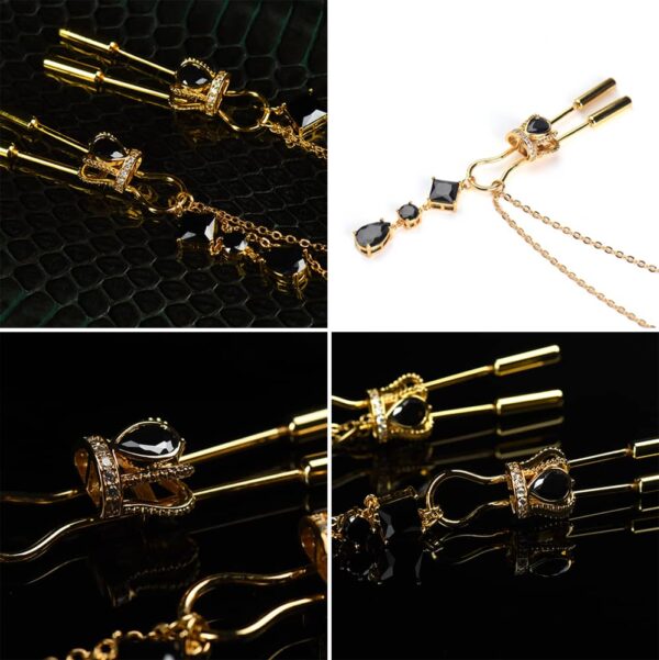 Crown nipple clamps in gold and black crystals with chain and UPKO pendants at Brigade Mondaine
