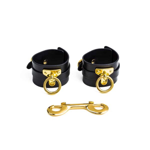 Black handmade leather handcuffs and 24K gold links UPKO at Brigade Mondaine