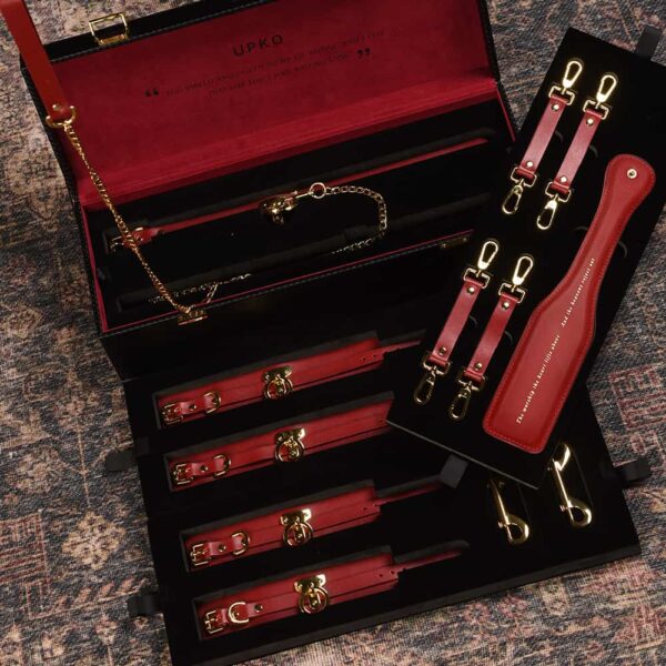 BDSM bondage accessories in burgundy red leather with gold plated finish UPKO