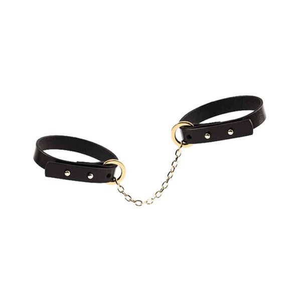 Thin black leather strap with 24K gold handcuffs UPKO at Brigade Mondaine