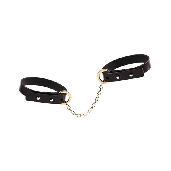 Bracelet fin en cuir noir avec attache de menotte en or 24K UPKO chez Brigade Mondaine