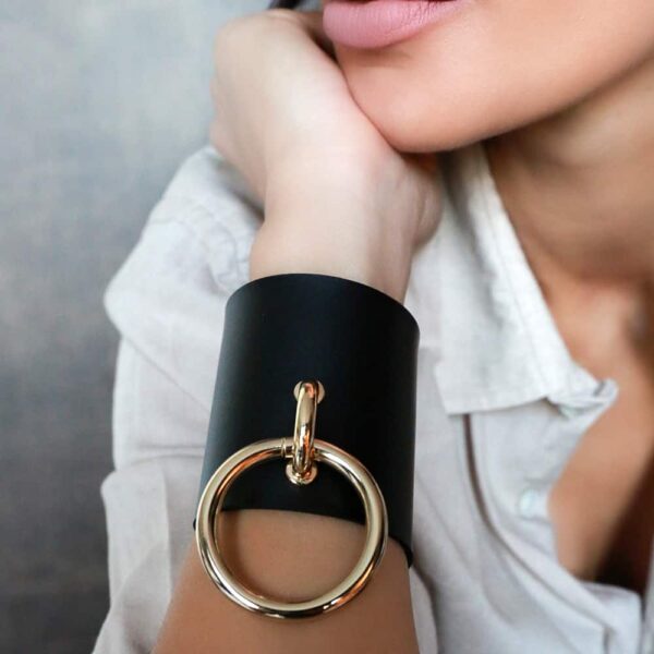 MARIA BRACELET / Black leather cuff with large gold metal ring by MIA ATELIER at BRIGADE MONDAINE
