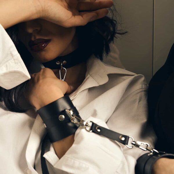HANDCUFFS SENSUALITY handcuffs in black Nappa leather and gold metal finishes by MIA Atelier at BRIGADE MONDAINE