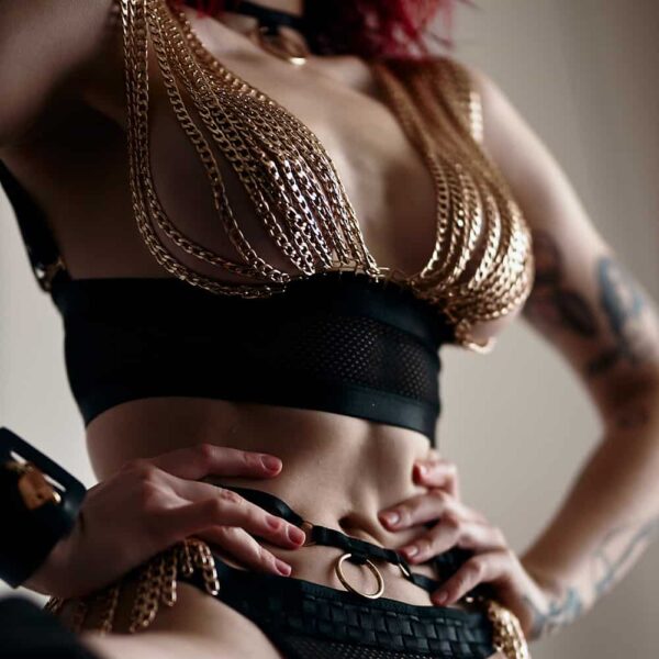 Roleplay costume string black fishnet and gold chains covering the breasts BAED STORIES at Brigade Mondaine