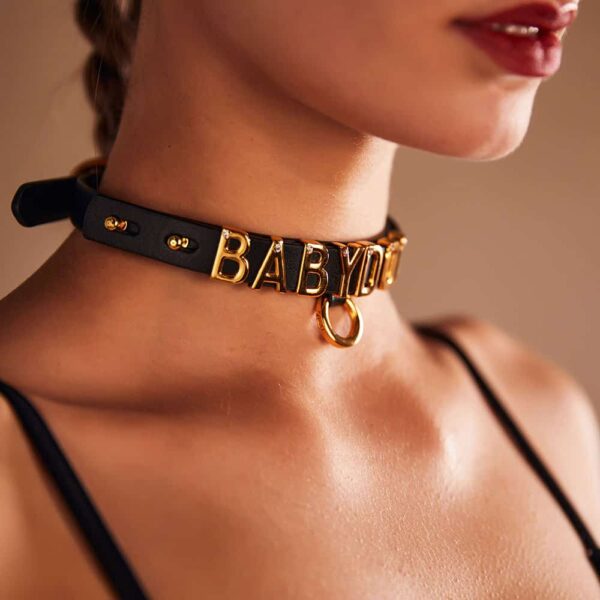 Choker resulting from the collaboration between Brigade Mondaine and Upko. The base of the choker is made from Italian leather and each letter is plated with 24-carat gold and encrusted with a crystal each.