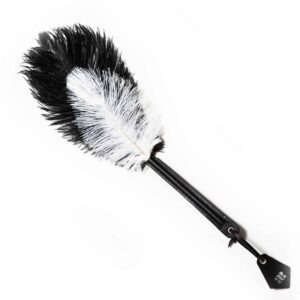 black and white ostrich feathers on black leather handle, the whole object measures 45cm and the feathers 25cm