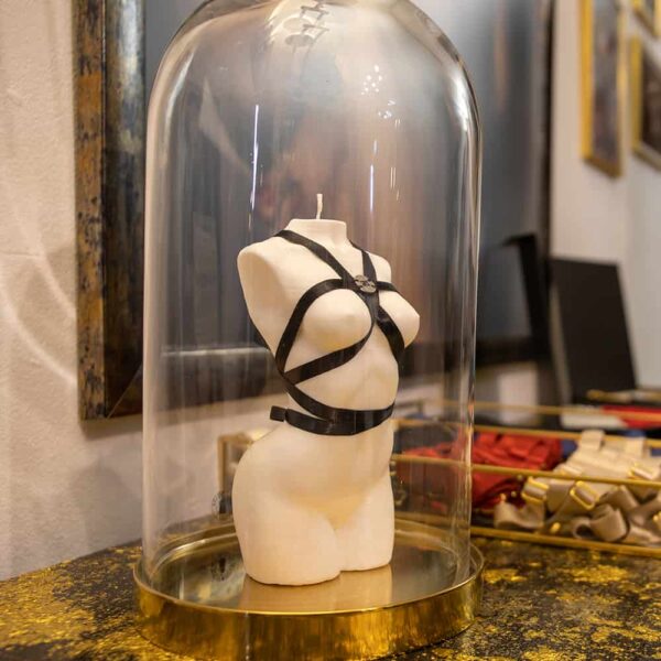 Local Brigade Mondaine. A woman's body candle from a collaboration between Baed Stories and Brigade Mondaine. This candle is made from 100% vegetable wax, it is made from white wax and has a black fabric harness. It measures 16cm high and 7cm wide.