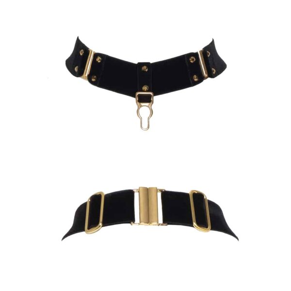 Black Verene necklace by Hervé by Celine Marie. This necklace is made from black elastic in thick soft velvet and 24 carat gold plated settings and hooks. A gold clasp is placed as a pendant, next to it are two hooks framed with nails. At the back, a clasp and settings are present.