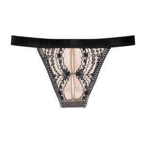 Cadolle panties from the Arceau collection, made of black embroidery from a floral universe on a skin colored tulle. A black elastic is placed around the hips. The back of the panties is opaque and black.