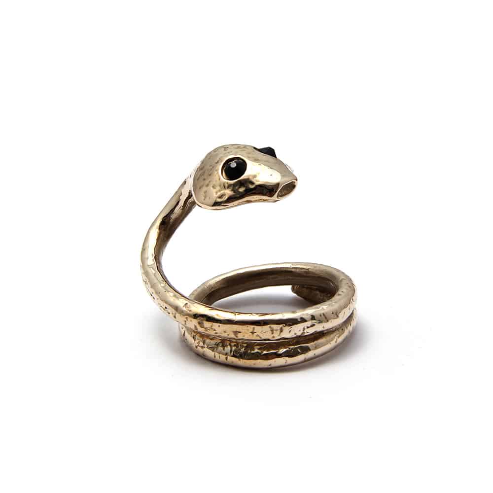 This is a ring in the shape of a snake. The snake has black stones for eyes. The tail of the snake curls up to form a wide ring.