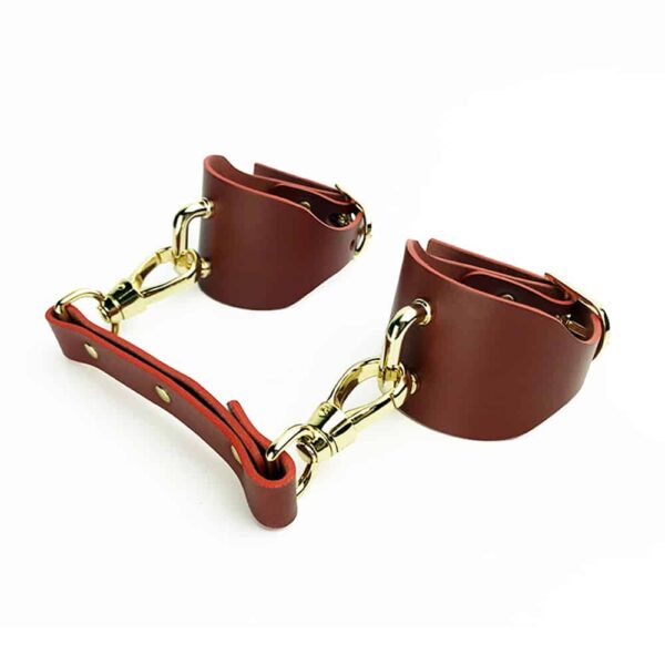 ELF Zhou London red leather handcuffs with carabiner and gold finishings