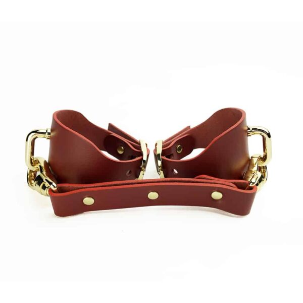 ELF Zhou London red leather handcuffs with carabiner and gold finishings