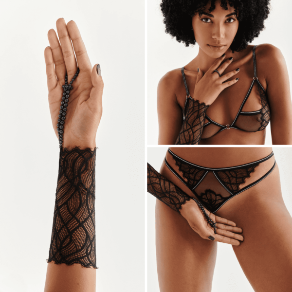 Black lace cuff G-Spot from the Manhattan collection by Bracli. The wrist is made of lace and covers half of the forearm. At the end of the wrist, there are black beads that can be attached to the finger.