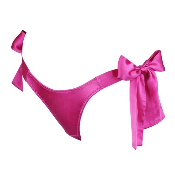 Pink silk panties Electra by Kaimin. The panties are simple but notched on the front and shaped like a tanga in the back. Two large bows decorate the product on the hips.