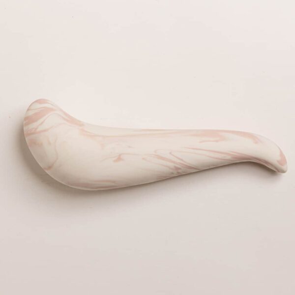 The spur thick on top and thinner tip, it is porcelain color pink and white from Adeles brydges at brigade mondaine