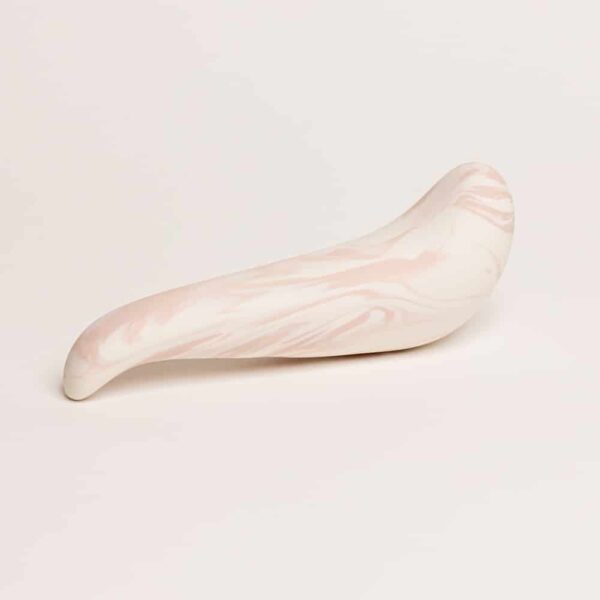 The spur thick on top and thinner tip, it is porcelain color pink and white from Adeles brydges at brigade mondaine