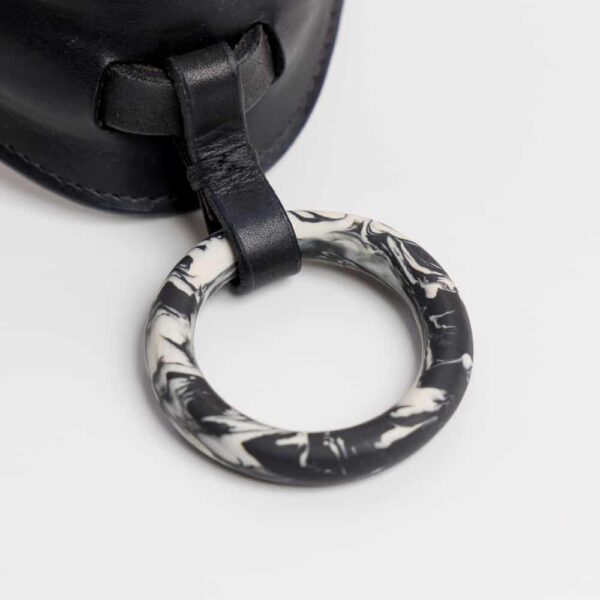 Black leather choker necklace with a black and white marble middle ring by Adele Brydges at brigade mondaine