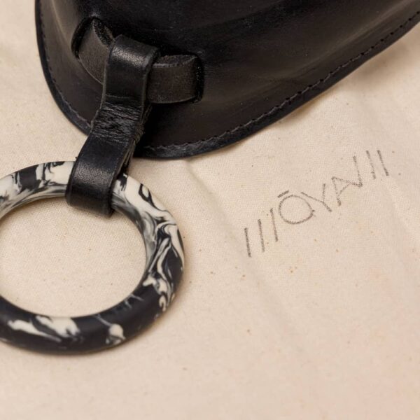 Black leather choker necklace with a black and white marble middle ring by Adele Brydges at brigade mondaine