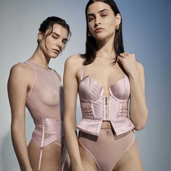 Products from the Kora collection by Bordelle.The pink basque is the signature piece of this collection. Designed as an outerwear centerpiece, with structured and molded cups. and the pink bodysuit that features a transparent mesh, 24-karat gold-plated finishes make this bodysuit a true jewel of high fashion