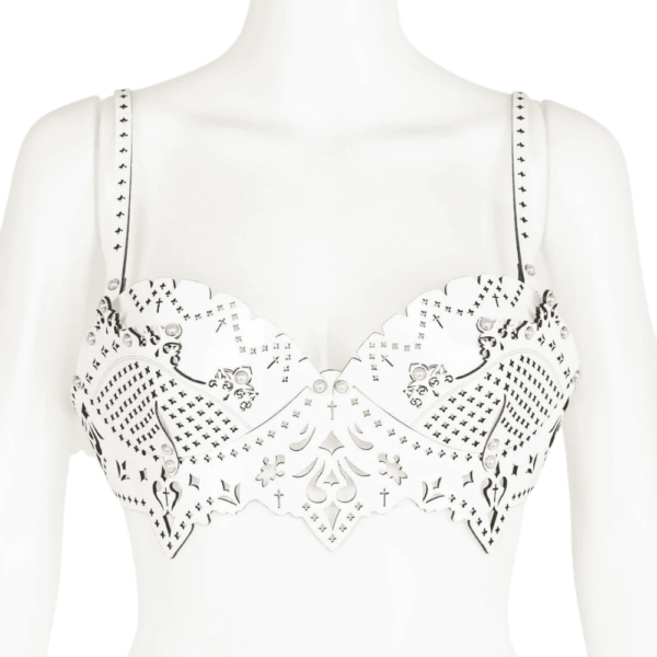 Bra from the Original Sin Bianco collection by Fraulein Kink by Brigade Mondaine. Entirely handcrafted to order in the brand's Berlin workshops from laser-cut patent leather, the Bianco bra is made to be seen. This meticulously laser-cut patent leather bra has removable straps and can be worn both over your favorite silk blouse or dress or directly on the skin. A very luxurious piece to draw attention in and out of the bedroom. Custom laser cut white patent leather bodice. Silver Pearl Ivory Double Cap Rivets. Adjustable and removable ivory bra straps. Adjustable stretch back hook closure.