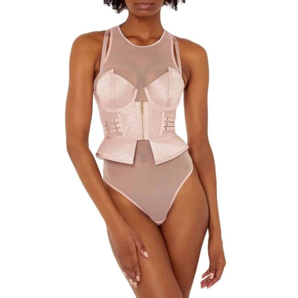 The Basque Kora is the signature piece of this collection. A most luxurious piece of lingerie designed as an outerwear centerpiece, with structured and molded cups. The cups are reminiscent of the iconic and coveted Angela dress. Fine tulle panels on the sides offer maximum comfort. Large 24-karat gold-plated zipper closure on the front. Clear shoulders. All elastic straps are adjustable to your morphology for a guaranteed comfort. Available at Brigade Mondaine.