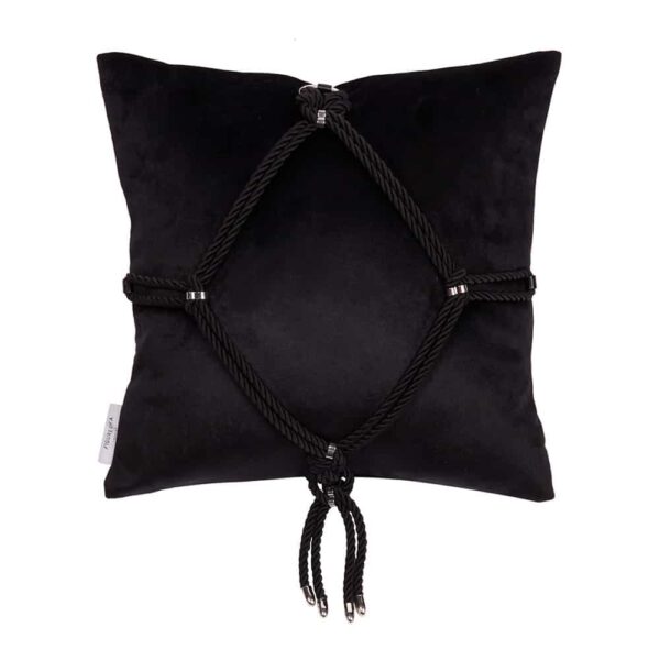 This soft velvet pillow with a Shibari ornament tied on the front - the classic "Kikkou" diamond pattern. Executed in the same manner as all other Figure of A products, with gunmetal hardware and dangling spiked rope ends, it's a unique gift that looks great placed on a sofa or bed. This pillow is available at Brigade Mondaine.