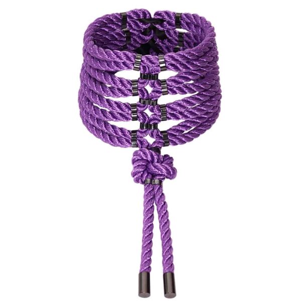 In Japanese, the word "shibari" means "to tie". The contemporary meaning of the word describes an artistic form of bondage. This Posture Collar wraps the neck following the curves of the body. It features a lover's knot in the center. The dangling rope tips are finished with zinc alloy metal caps. Back closure. Silver finish. Fully adjustable. One size fits all.