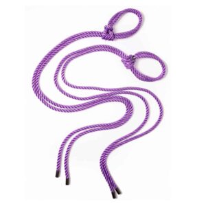 This Self-Tie set of do-it-yourself handcuffs is ideal for entering the world of Shibari. Made from 8mm polyester rope, soft and comfortable on the skin, tied with a noose and fitted with metal spikes. The cuffs can be tied around the ankles or wrist for a "quick catch". The strap is adjustable so you can tie the knot as tight as your partner can handle, then simply loosen the knot and slip on and off to allow more time for play. Length: 1.20 m / 47 inches. Available at Brigade Mondaine