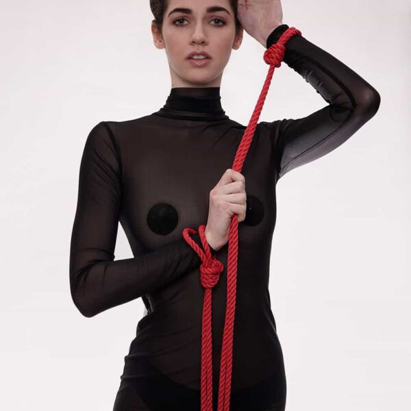 This Self-Tie set of do-it-yourself handcuffs is ideal for entering the world of Shibari. Made from 8mm polyester rope, soft and comfortable on the skin, tied with a noose and fitted with metal spikes. The cuffs can be tied around the ankles or wrist for a "quick catch". The strap is adjustable so you can tie the knot as tight as your partner can handle, then simply loosen the knot and slip on and off to allow more time for play. Length: 1.20 m / 47 inches. Available at Brigade Mondaine
