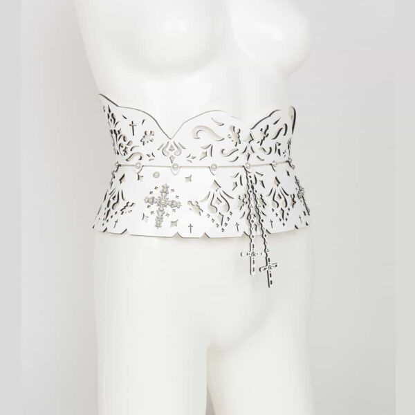 Garters belt from the Original Sin Bianco collection by Fraulein Kink on Brigade Mondaine. Entirely handmade to order in the brand's Berlin workshop from laser-cut white patent leather and ivory pearl rivets, the Bianco Garters Belt will leave no one indifferent at your fetish or erotic parties. This true statement piece is the ultimate in high fashion glamour. Wear with lingerie or over a pencil skirt for a high fashion look. Custom laser-cut white patent leather belt and suspenders. Adjustable leather and satin suspender belt and removable elastic straps. Crystal rivets edged with ivory pearl silver.