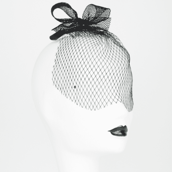 Mini bow hat and fishnet veil from the French Kiss collection by Fraulein Kink, available at Brigade Mondaine