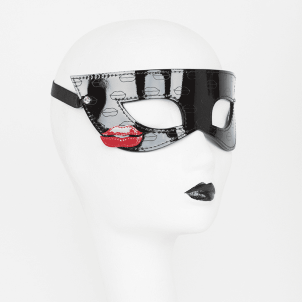 French Kiss mask by Fraulein Kink on Brigade Mondaine. Perfect for a night on the town or your next masquerade ball. Featuring laser embossed kisses and hand stitched red leather kiss details. The entire French Kiss collection is handcrafted to order in the designer's Berlin studio. This collection is inspired by French luxury with accessories that represent the fashion capital, Paris. Fraulein kink offers couture pieces that you won't see anywhere else.