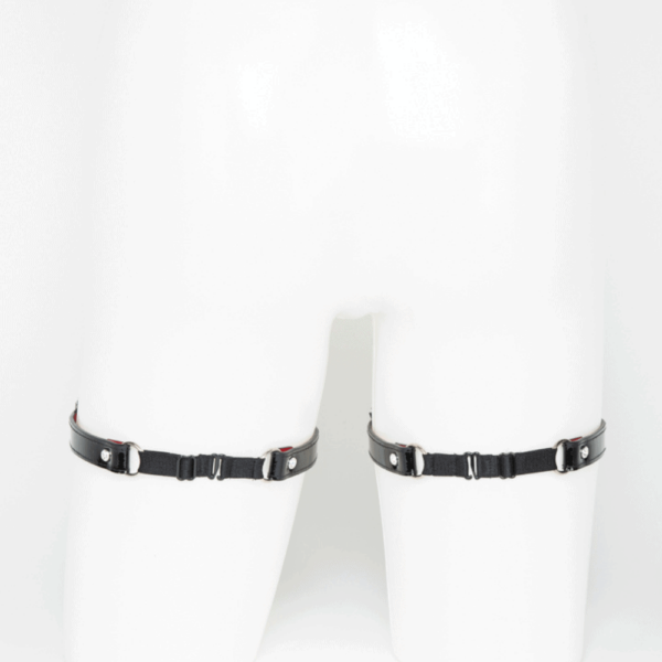 Black patent leather garters from the French Kiss collection by Fraulein Kink, available at Brigade Mondaine