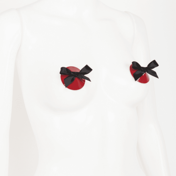 Bow nippies from the French Kiss collection by Fraulein Kink on Brigade Mondaine. The bow nippies are made of glossy patent red leather, in the middle there is a black hand-tied double ballet ribbon bow. The entire French Kiss collection is handmade to order in the designer's Berlin atelier. This collection is inspired by French luxury with accessories that represent the fashion capital, Paris. Fraulein kink offers couture pieces that you won't see anywhere else.