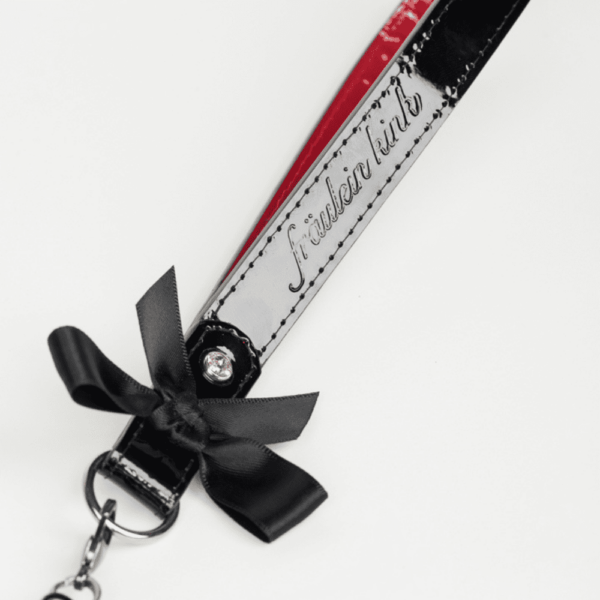 Black and red patent leather leash from the French Kiss collection by Fraulein Kink, available at Brigade Mondaine