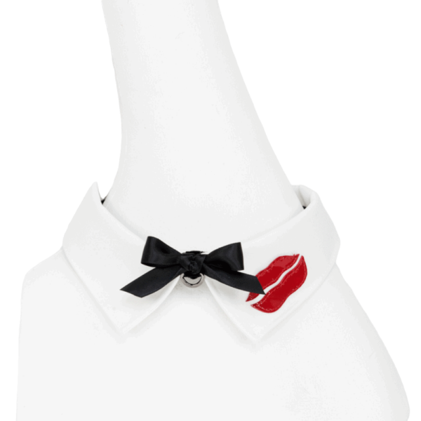 French Kiss necklace by Fraulein Kink on Brigade Mondaine. Ivory satin shirt collar necklace, lipstick leather details and hand-tied black satin bow. The entire French Kiss collection is handmade to order in the designer's Berlin atelier. This collection is inspired by French luxury with accessories that represent the fashion capital, Paris. Fraulein kink offers couture pieces that you won't see anywhere else.