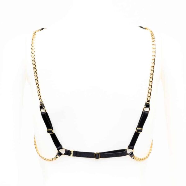 Chic and sexy! Our Rica Chain Harness is handcrafted from black patent leather, finished with high quality 24K gold plated brass rivets and chain, and adjustable satin elastic closures to comfortably wrap your body. Wear this glamorous sling over your favorite silk blouse, dress or directly against your skin. Black patent leather straps 24K gold plated brass double cap rivets and chain Adjustable black double sided satin elastic straps Adjustable stretch back hook Available in two sizes - one (S/M) and two (M/L). Please see the size chart for measurements.
