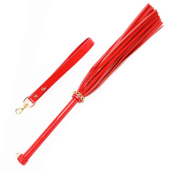 Excite and tease with the ultimate bedroom accessory! Our Roja Flogger is handcrafted from a combination of Italian patent leather and matte red. The flogger features a detachable handle and 24K gold rivet and chain details to add the perfect finishing touch to this high fashion accessory. Red Italian patent and matte leather straps Wood reinforced shaft Removable 24K Gold Rivet & Chain Accent handle