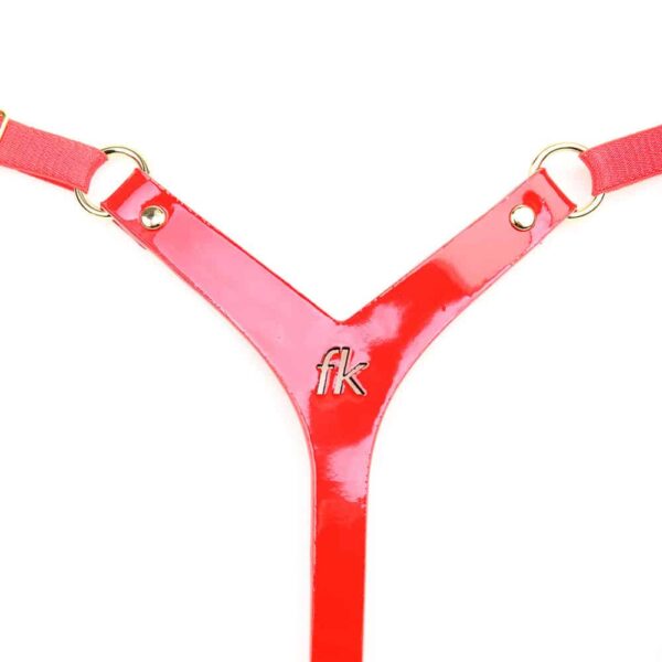 Embellish your body with our sexy leather mini thong. Handcrafted from red patent leather with laser-cut CF logo and 24k gold double cap rivets, chains and trim. Adjustable satin elastic for easy size adjustments. Indulge in luxury bondage! Red patent leather thong Laser Cut FK logo Adjustable 24K gold chain and satin elastics on both sides 24k gold plated double cap rivets Embossed Fräulein Kink logo One size fits all - See size guide for measurements