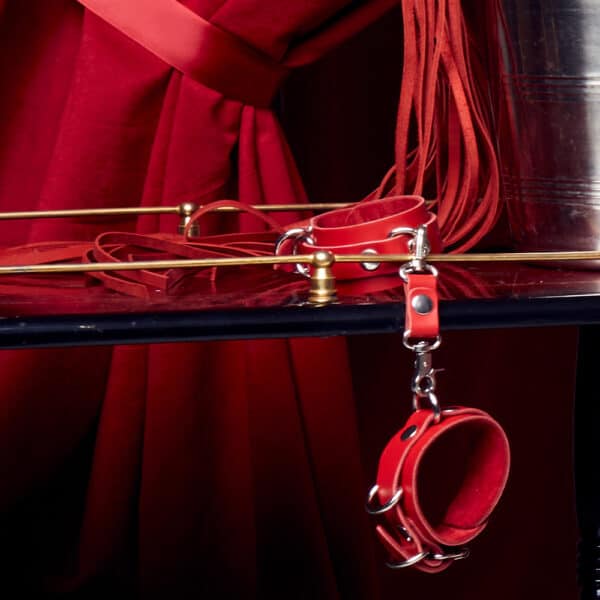 Red handcuffs with solid metal details won't unlock you easily