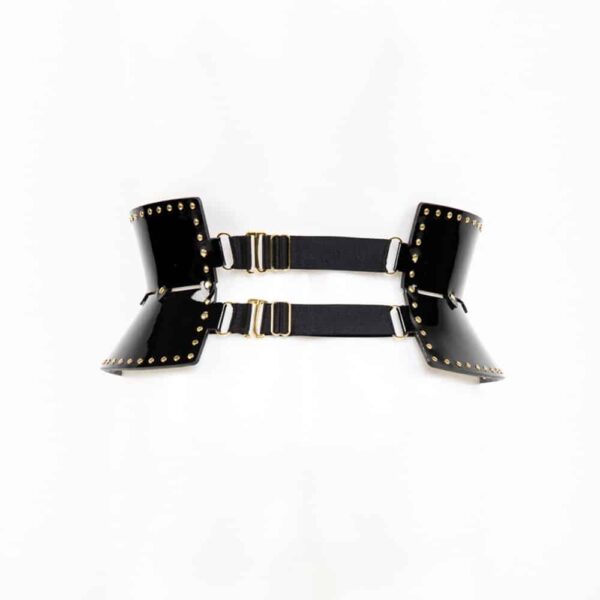Ricco Belt Garter, the creation inspired by the ultimate essence of glamour. The Ricco belt has adjustable and removable leather suspenders. Wear this luxurious creation with lingerie or over a pencil skirt for a high fashion look. Removable leather and satin elastic leg straps. Gold brass double cap rivets. A fashionable and versatile piece! Available in 2 sizes.