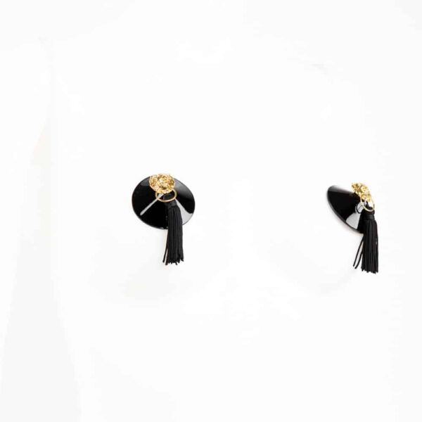 The ultimate object of desire, molded in high quality Italian patent leather and embellished with gold brass rivets, these Leone nipple covers are adorned with gold lion head and pompom details. Wear with an open bra or just under a transparent top for a very haute-couture look.