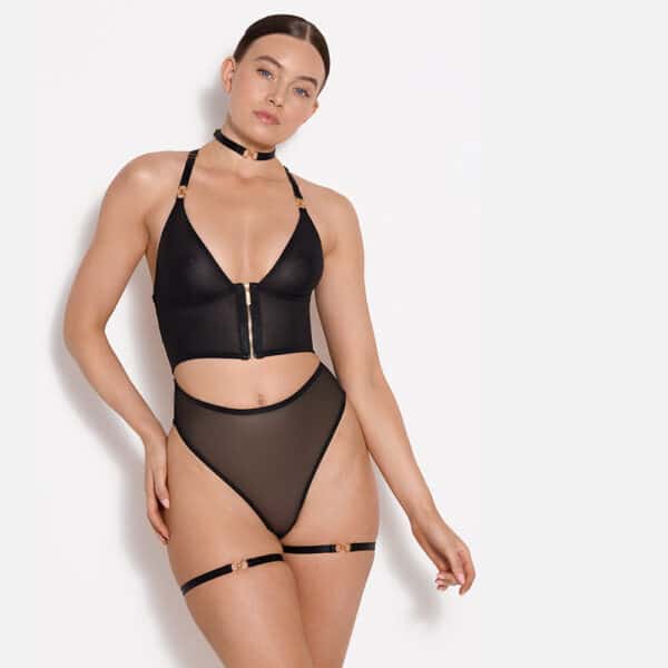 Front view of a black lingerie set with transparent silk thong, harness and corset bra
