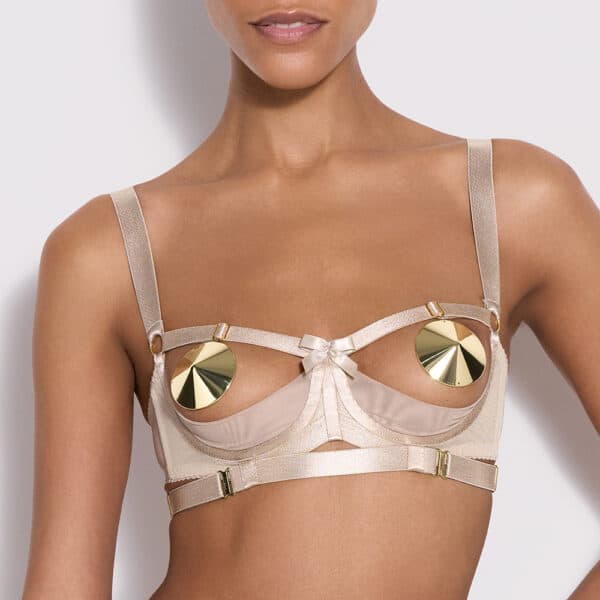 Woman standing with Gia Cream Bra with and strong gold hooks from Bordelle and gold hooks